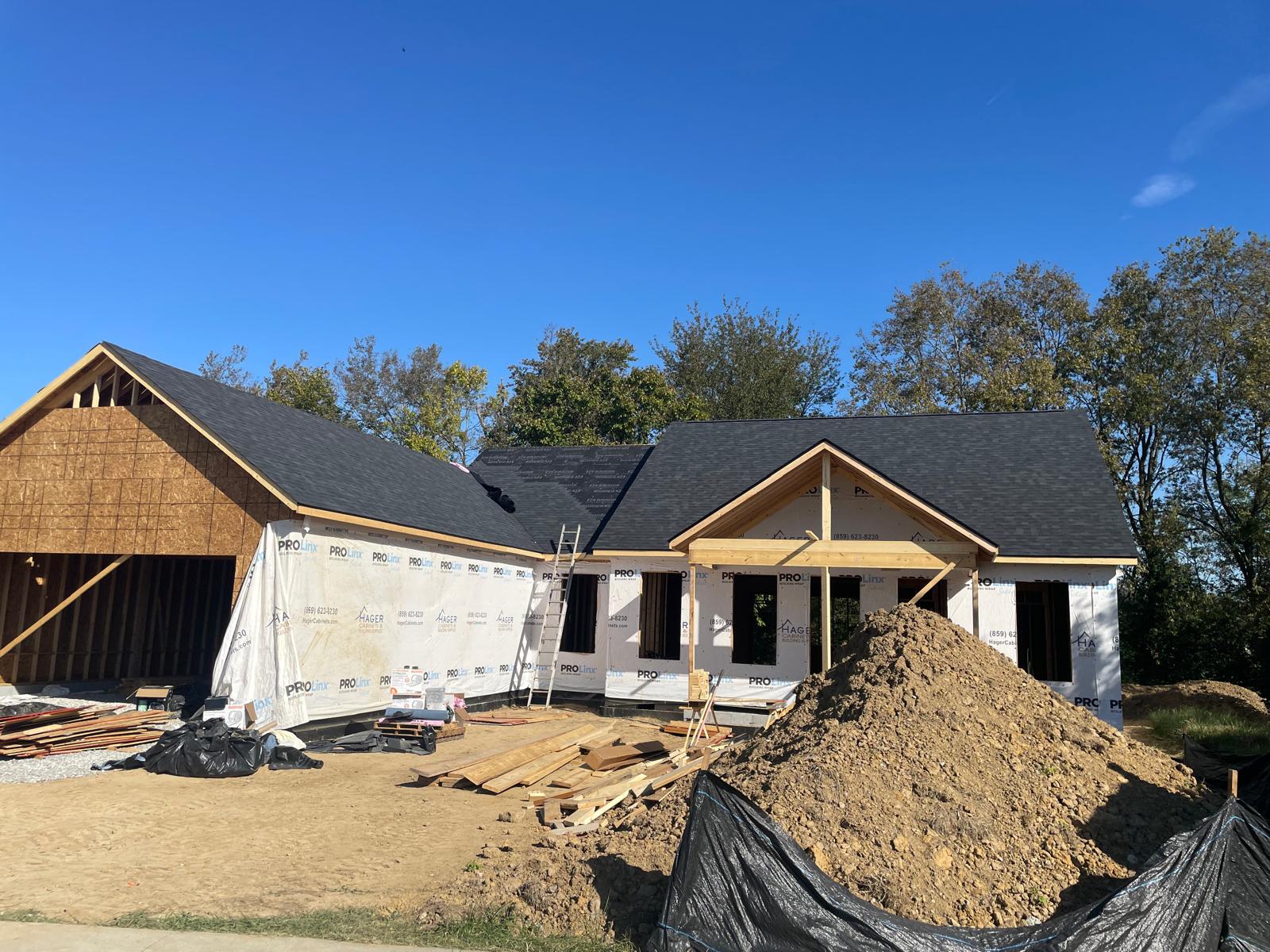 New construction home with fresh roof and framing